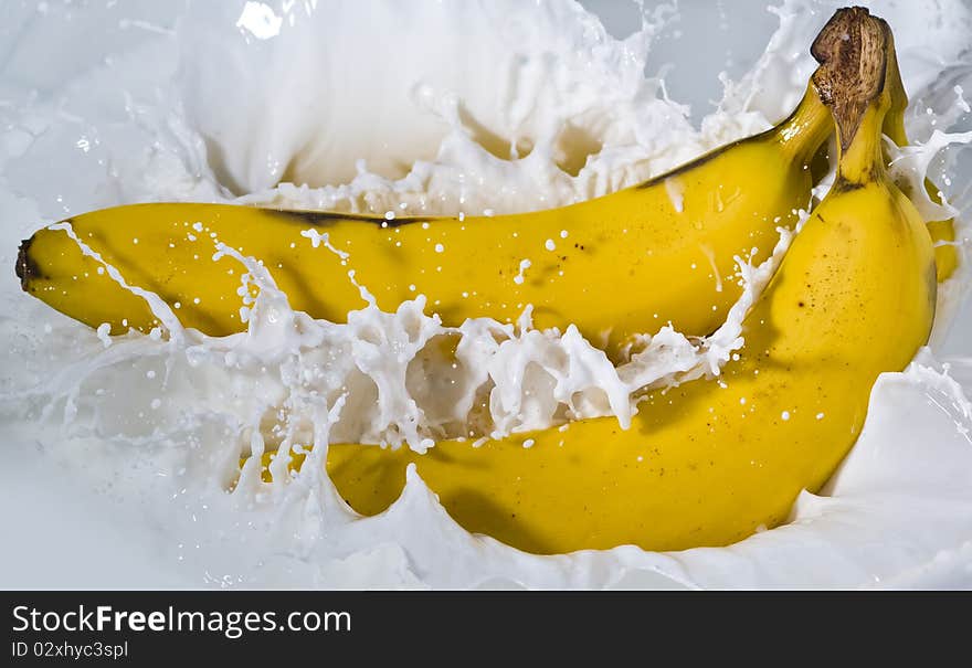 View of bananas falling into milk