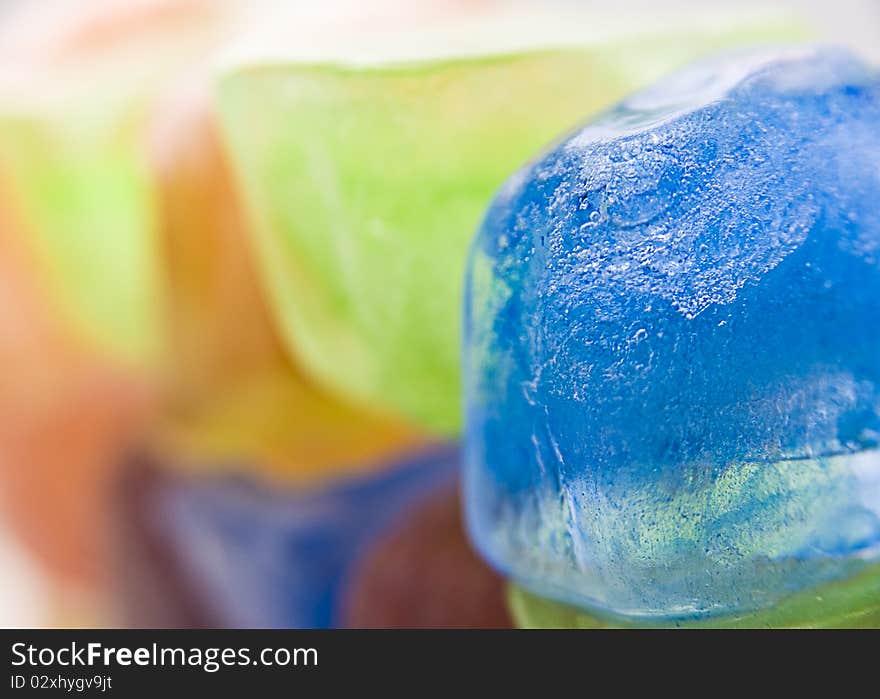 A set of colored ice cubes on white background