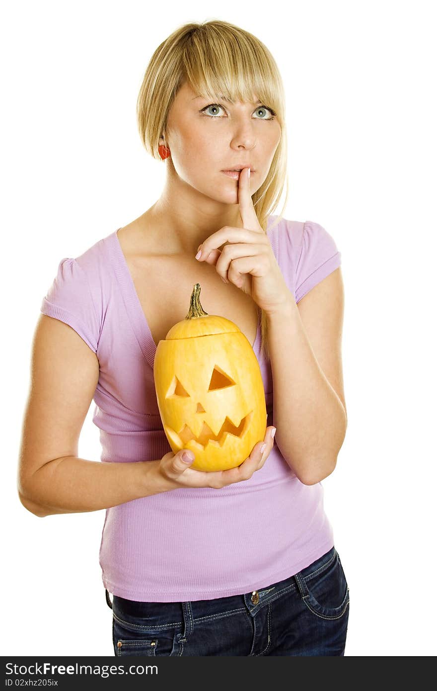 A young girl frightened with pumpkin for Halloween. Gesturing for Quiet or Shushing. Lots of copyspace and room for text on this isolate. A young girl frightened with pumpkin for Halloween. Gesturing for Quiet or Shushing. Lots of copyspace and room for text on this isolate