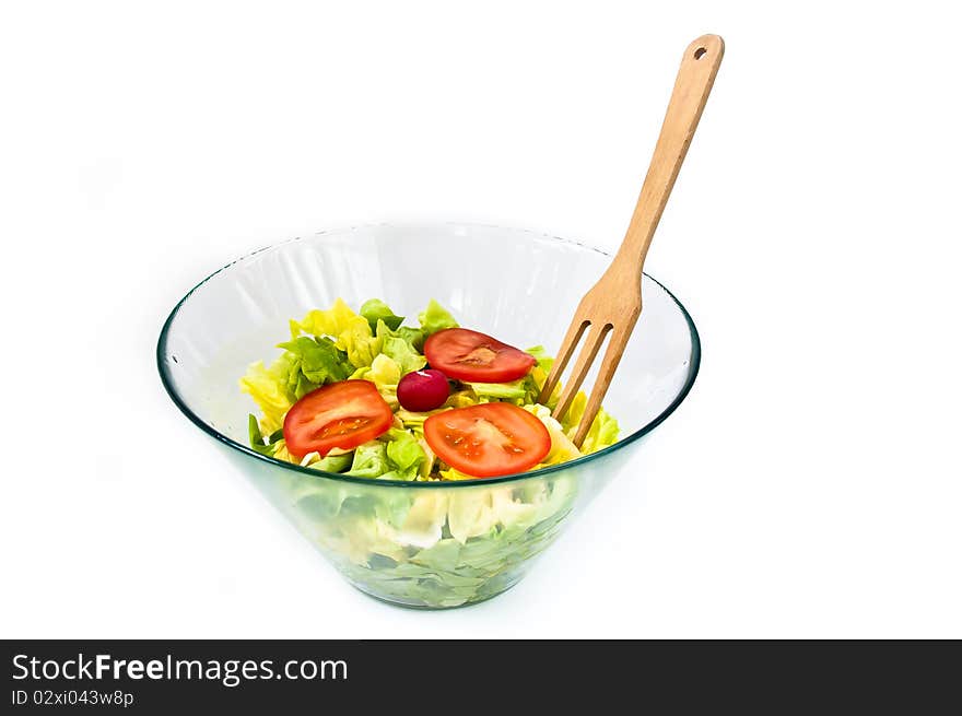 Bowl of salad with wooden spoon