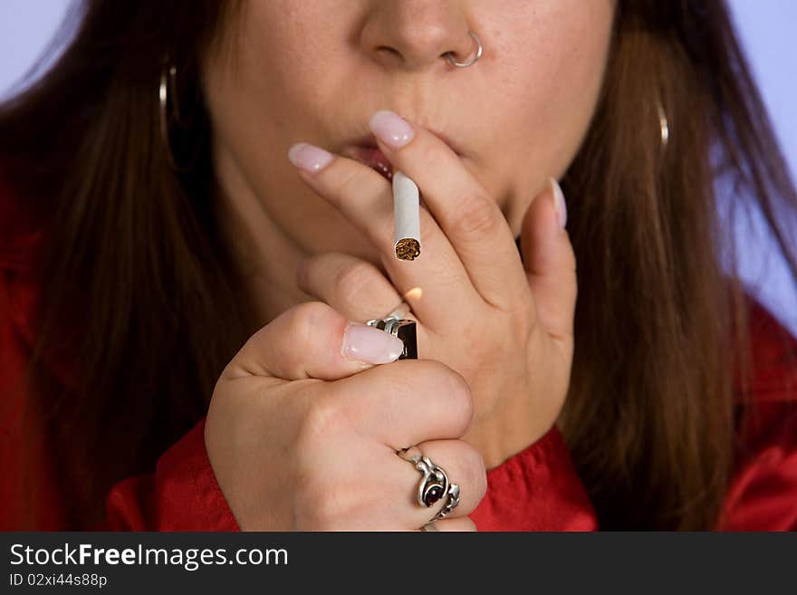 Woman lighting a cigarette