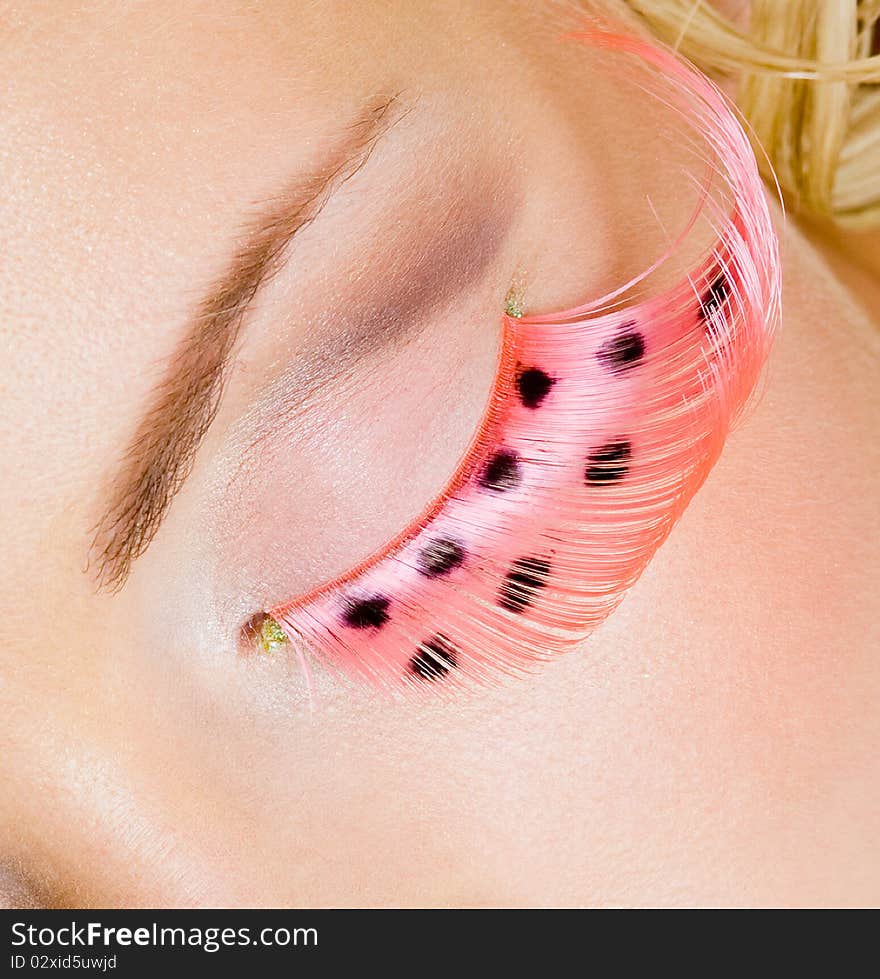 Pink eye make-up with false eyelashes