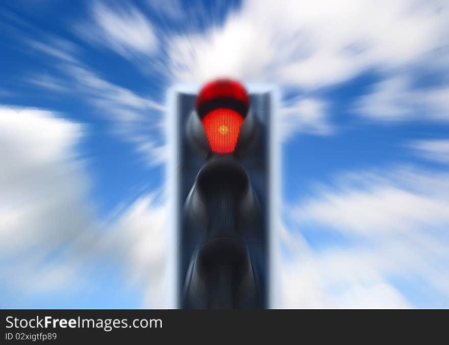 Red traffic light against cloudy blue sky with zoom effect. Red traffic light against cloudy blue sky with zoom effect