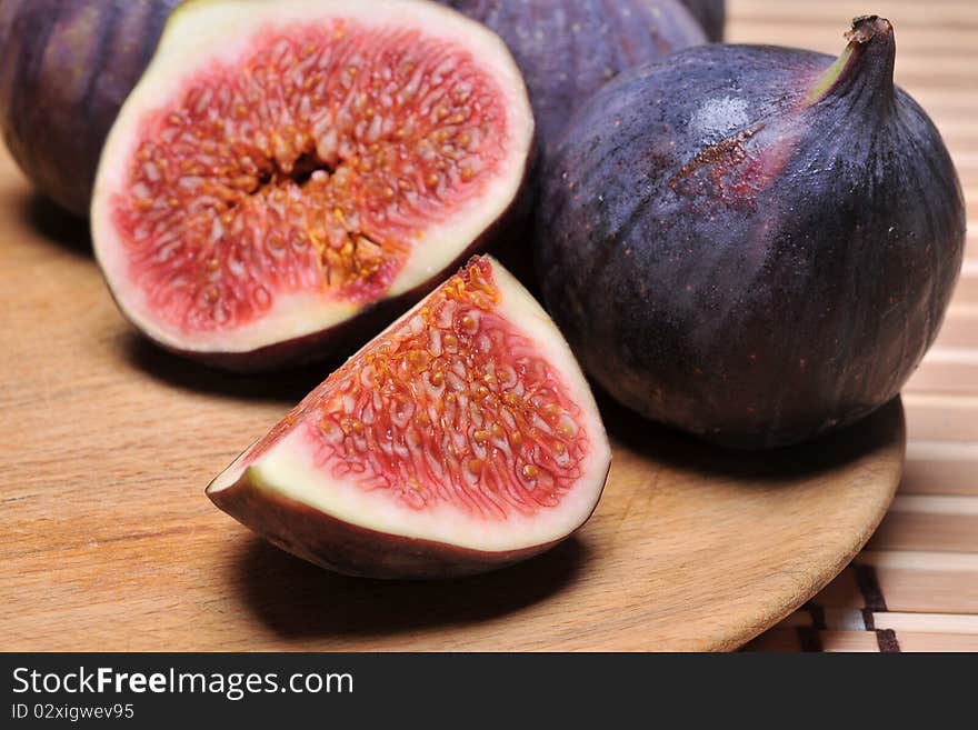 Slice fig on wood background. Slice fig on wood background