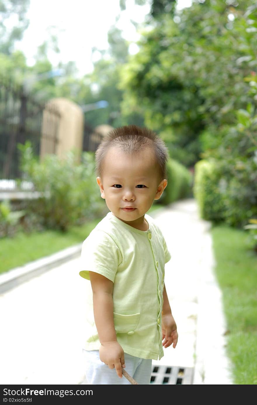 It is a cute chinese baby in the outdoor. It is a cute chinese baby in the outdoor.