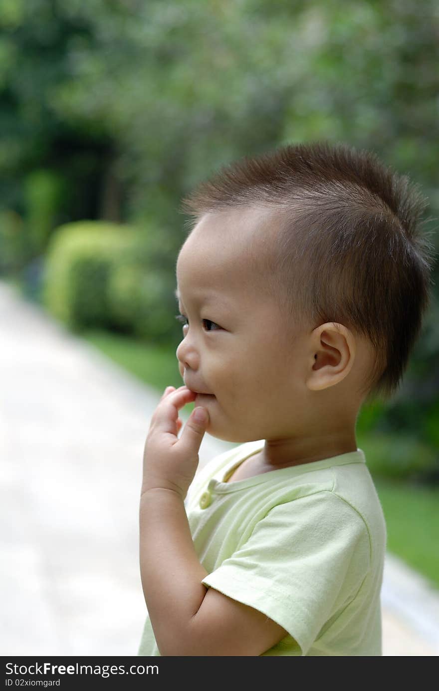 It is a cute chinese baby in the outdoor. It is a cute chinese baby in the outdoor.