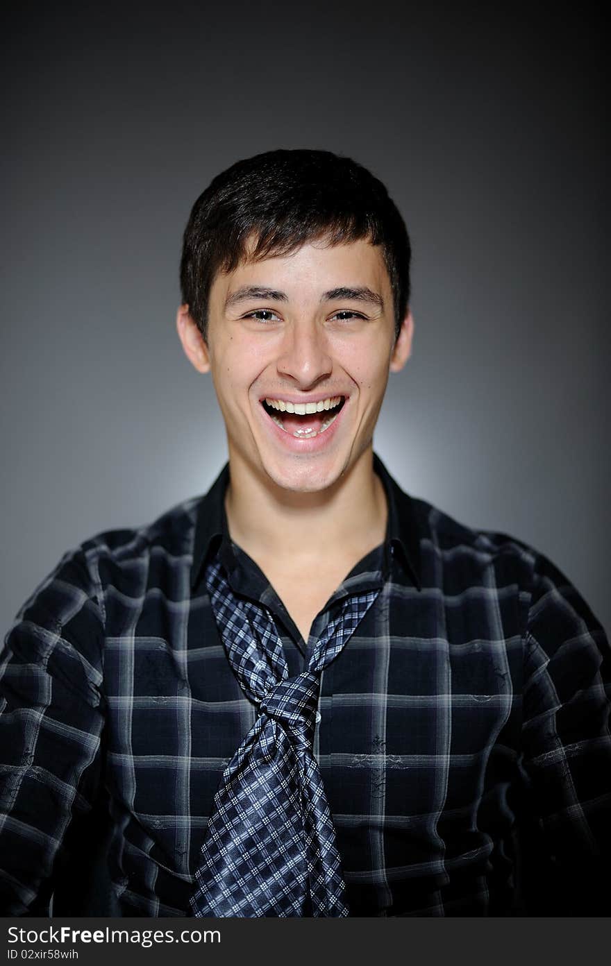 Expressions Handsome man in funny shirt and tie laughing. Expressions Handsome man in funny shirt and tie laughing