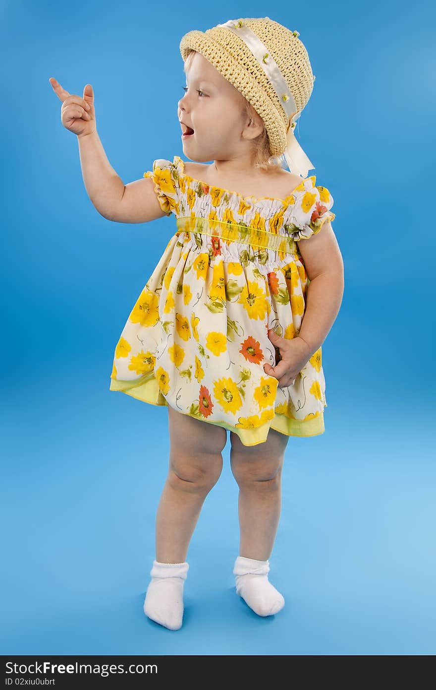 Beautiful little girl the blonde on a blue background. Beautiful little girl the blonde on a blue background