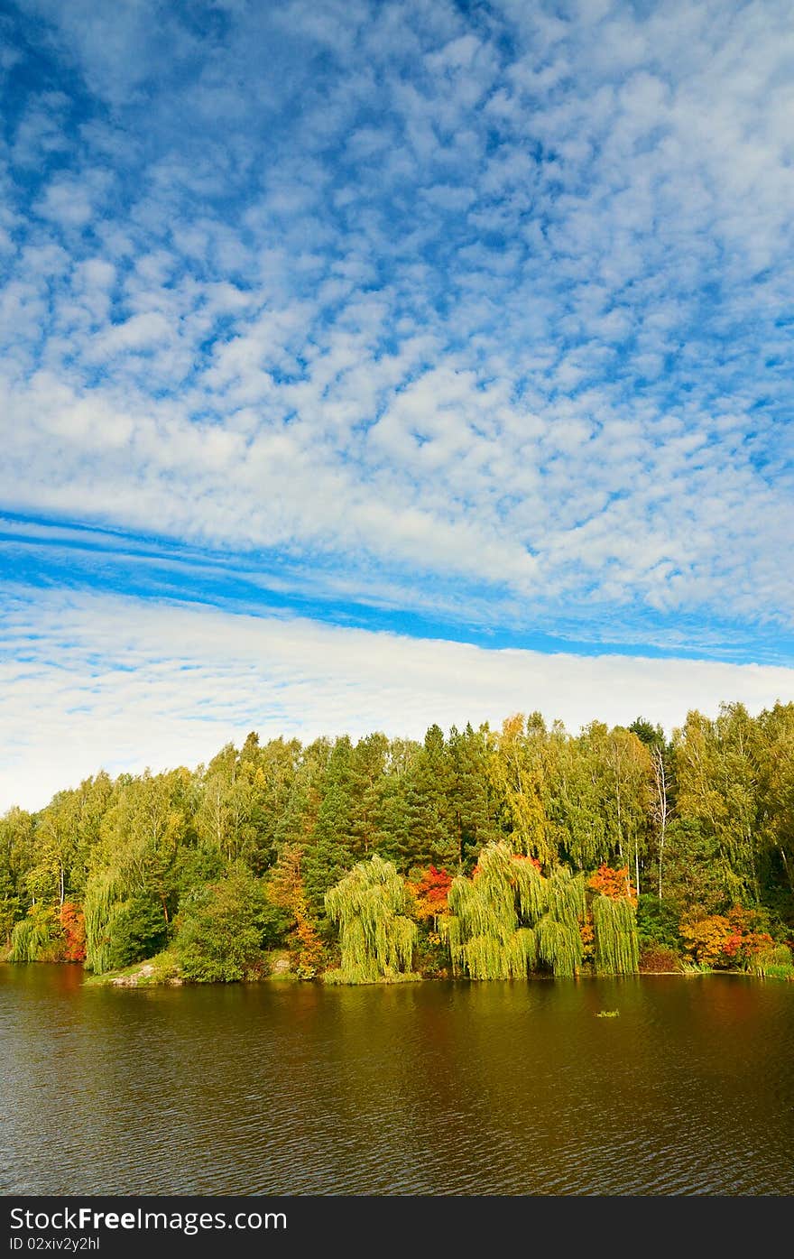 Picturesque autumn landscape of lake and blue sky. Picturesque autumn landscape of lake and blue sky.
