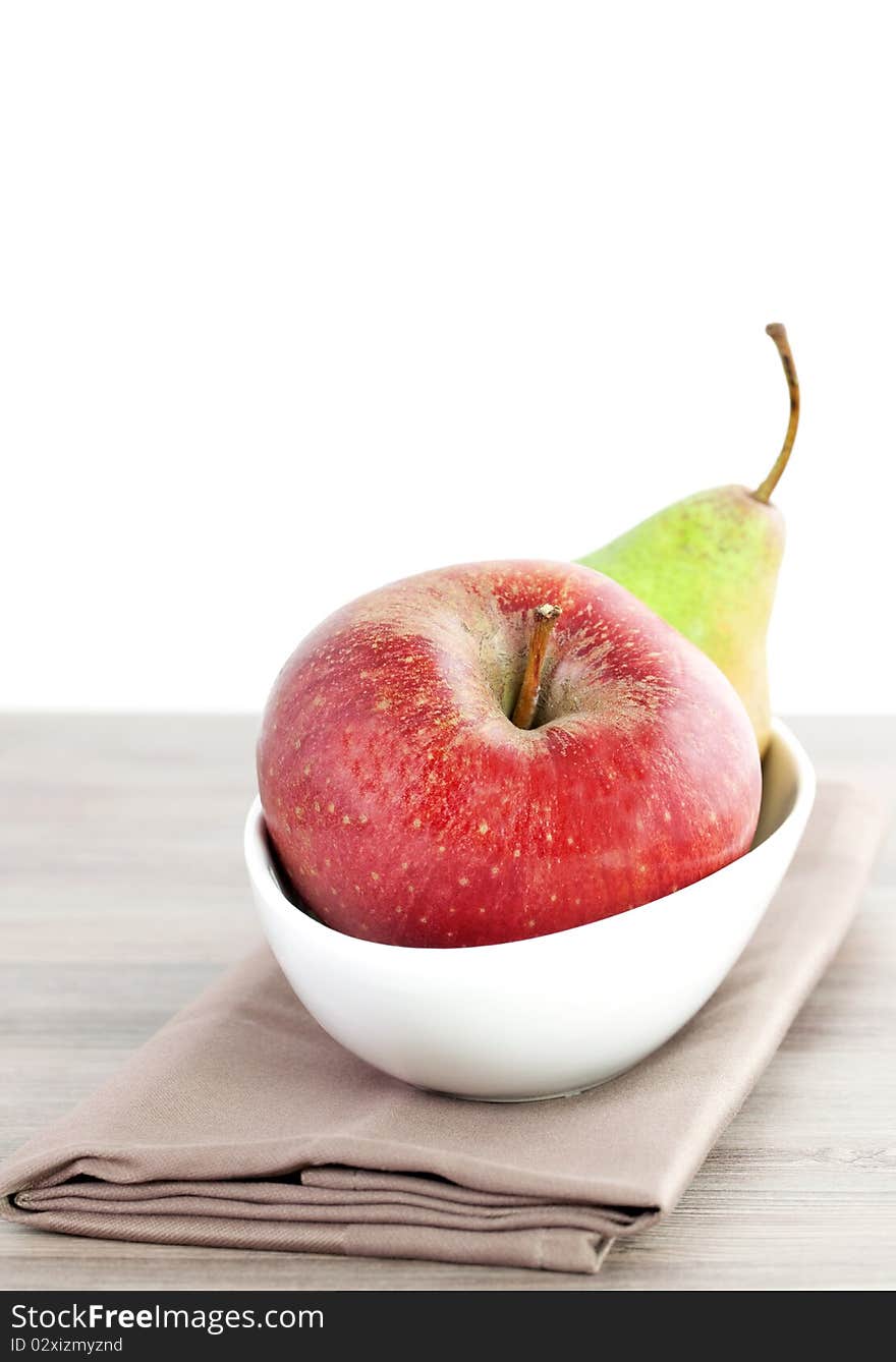 Apple and pear in a bowl