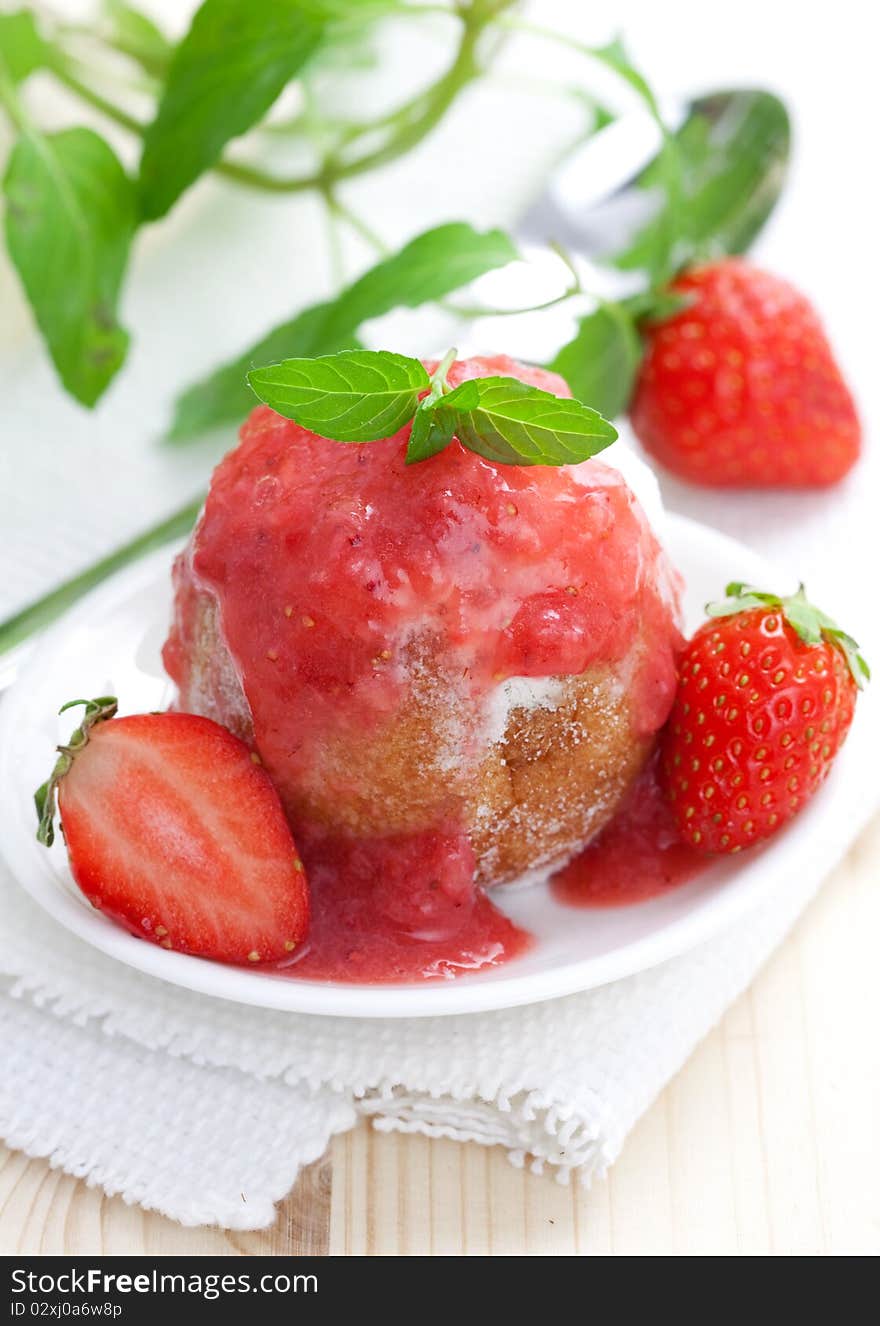 Fresh quark ball with strawberry sauce and mint