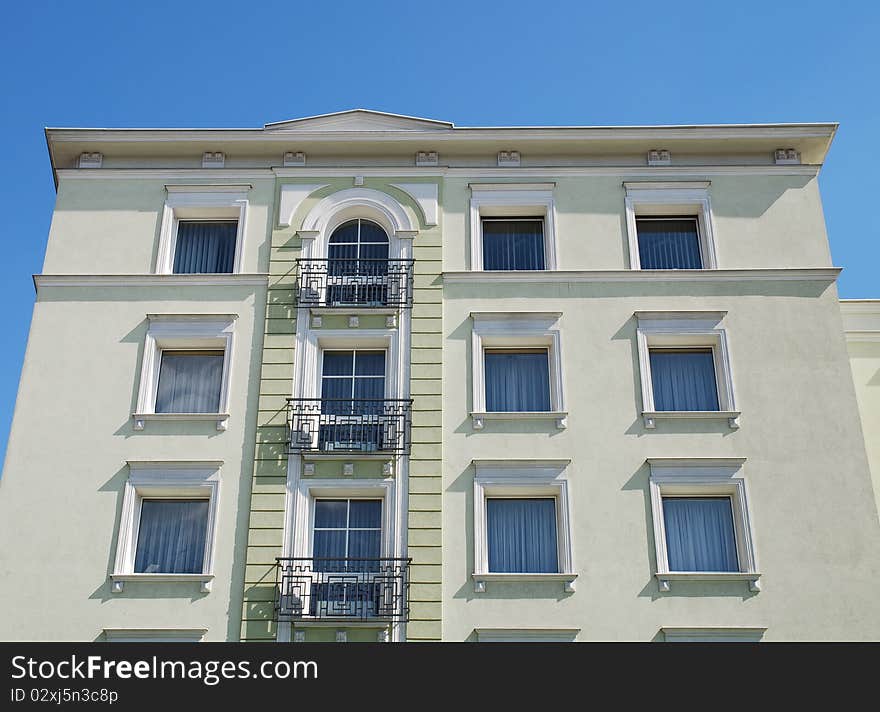 Fragment of the old building on the blue sky