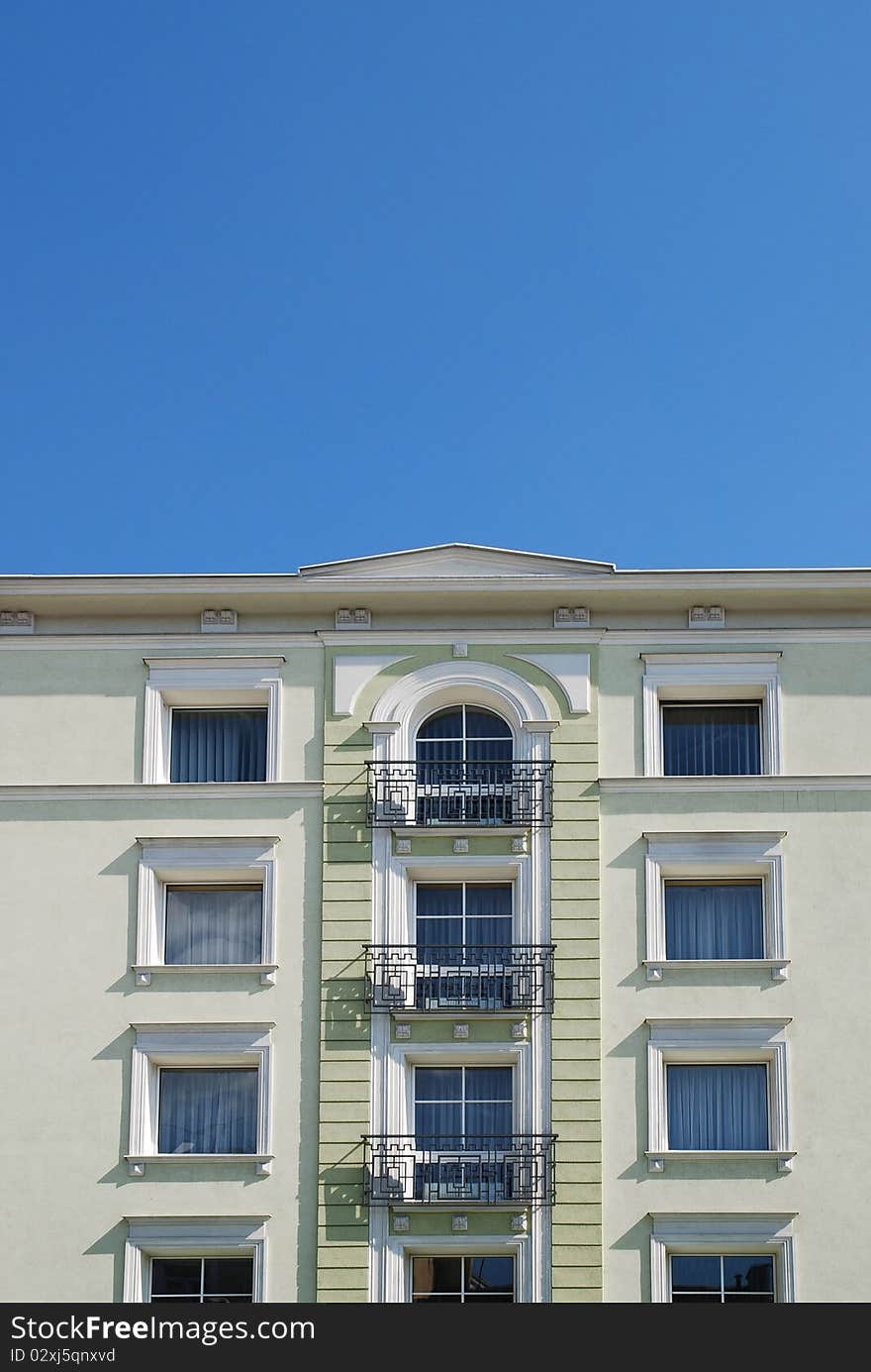 Fragment of the old building on the blue sky