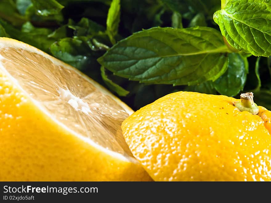 Sliced lemon and mint in background