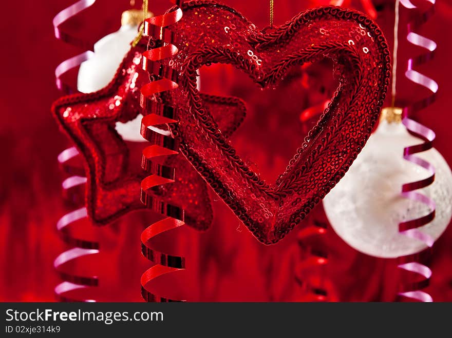 Christmas baubles and ribbons on red background. Christmas baubles and ribbons on red background