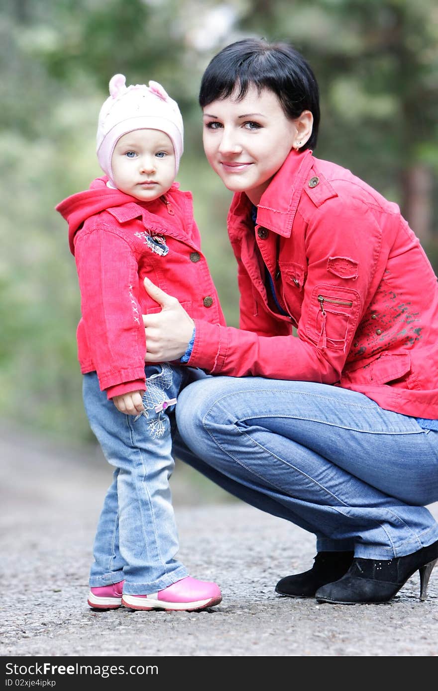 Mother and daughter in autumn park. Mother and daughter in autumn park