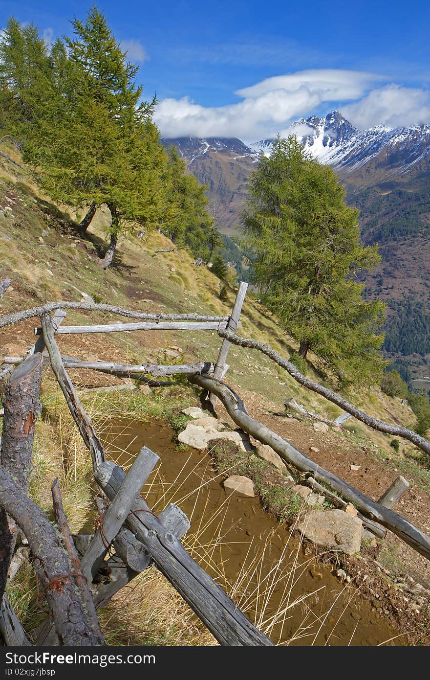 Raw fountain in the north of italian mountains