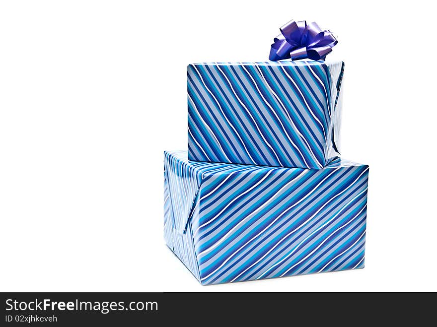 Two blue paper gifts boxes with bows. White background. Two blue paper gifts boxes with bows. White background