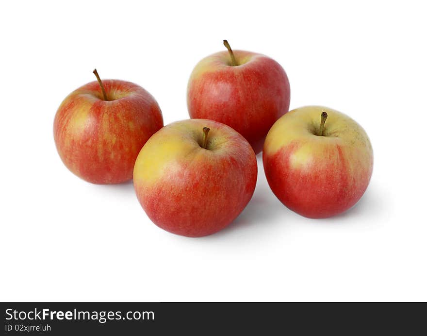 Four ripe juicy red apple on a white background