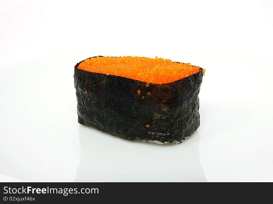 Red tobiko (flying fish roe) sushi closeup. Red tobiko (flying fish roe) sushi closeup