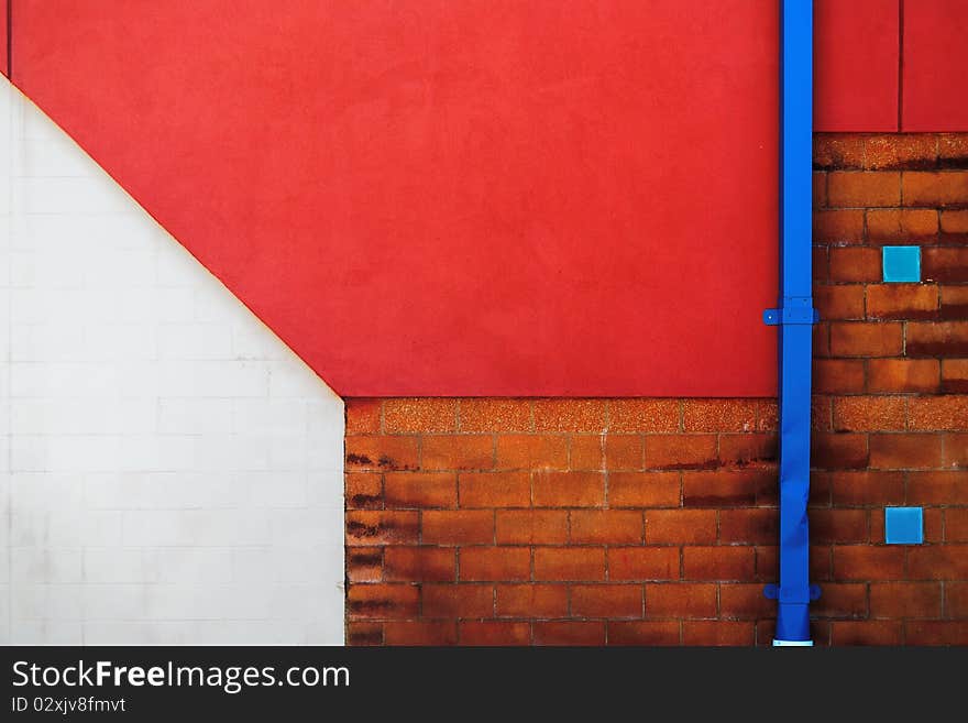 Detail of a colorful building wall with downspout. Detail of a colorful building wall with downspout