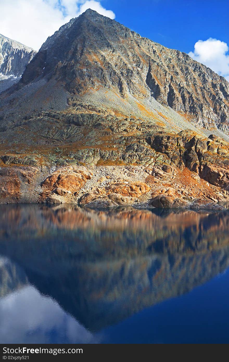 Crystal Peak shining in Baitone Lake at 2281 meters on the sea-level. Brixia province, Lombardy region, Italy. Crystal Peak shining in Baitone Lake at 2281 meters on the sea-level. Brixia province, Lombardy region, Italy