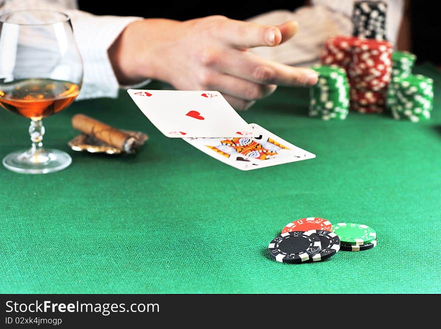 Man sitting at the gambing table and playing cards. Man sitting at the gambing table and playing cards