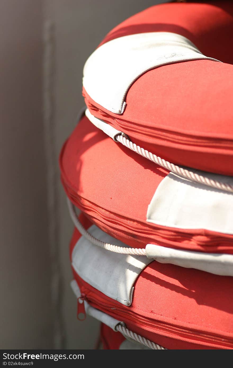 Three life buoys, on boat