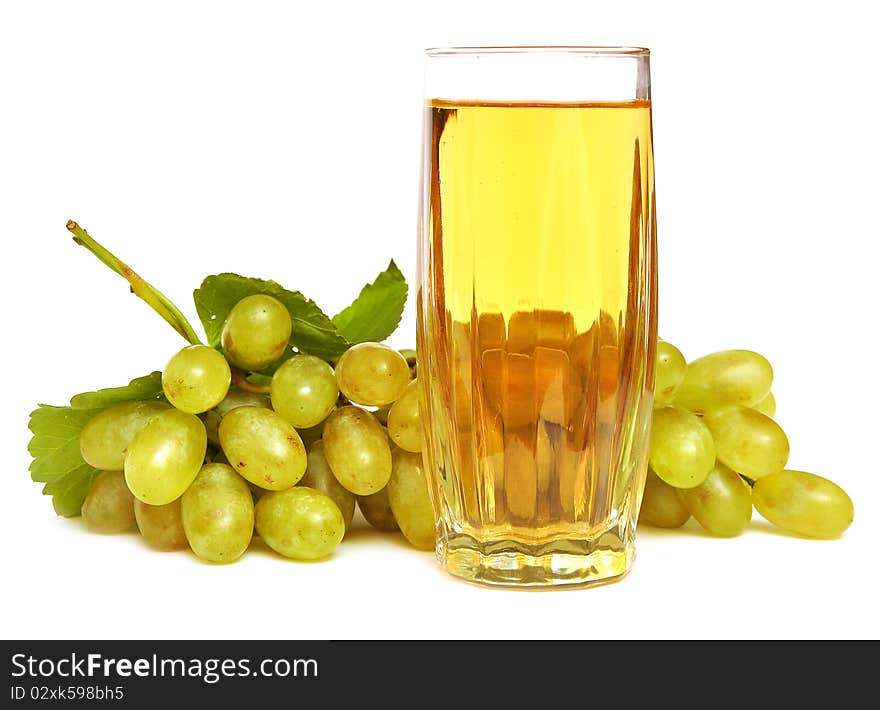 Glass with grapes juice on the white