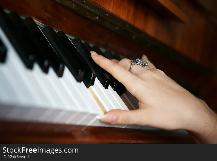 Hands Playing Music On The Piano