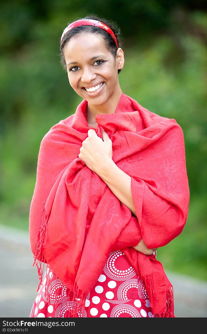 A young lady with dark skin and a lovely smile. A young lady with dark skin and a lovely smile