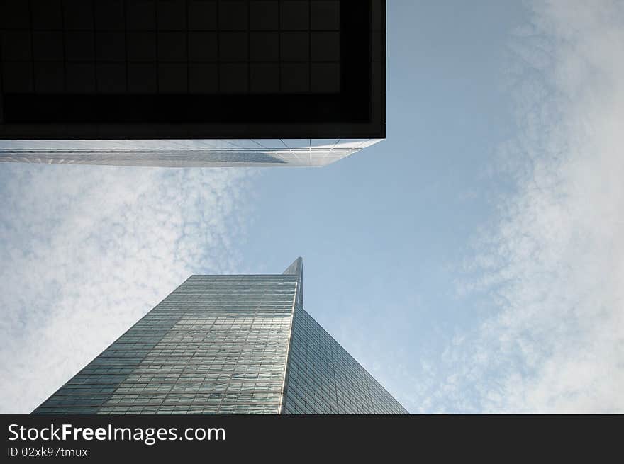 Looking upward at the skyscrapers and the sky in the city. Looking upward at the skyscrapers and the sky in the city.