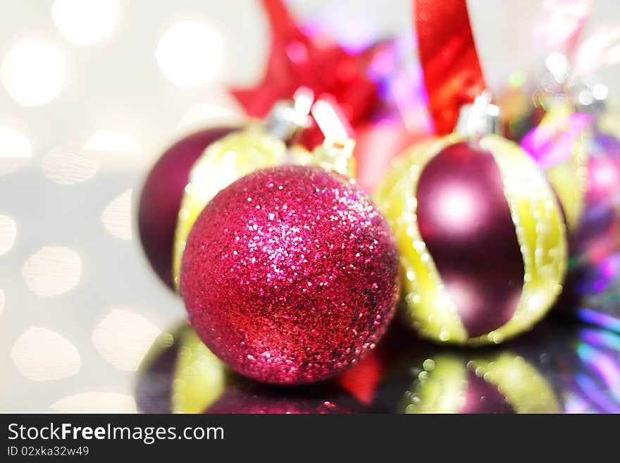 Three red Christmas balls on a light background