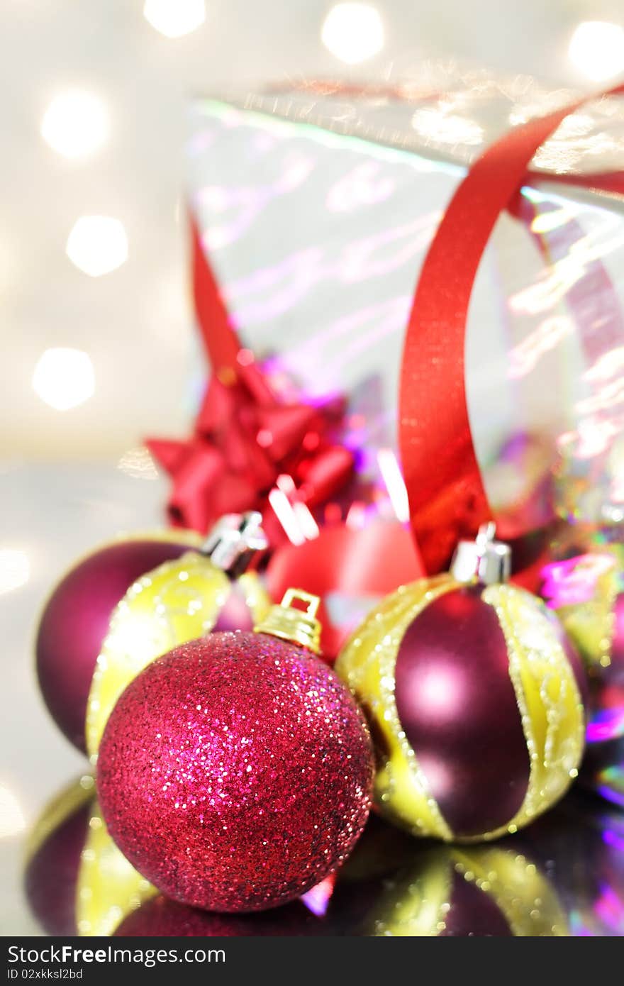 Three red Christmas balls on a red background