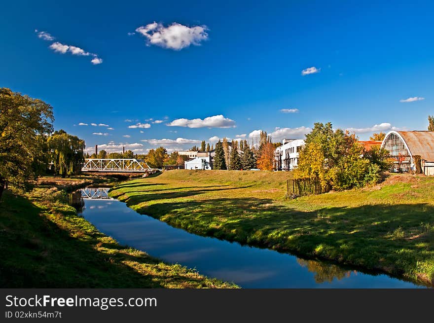 The river flows near to old factory. The river flows near to old factory