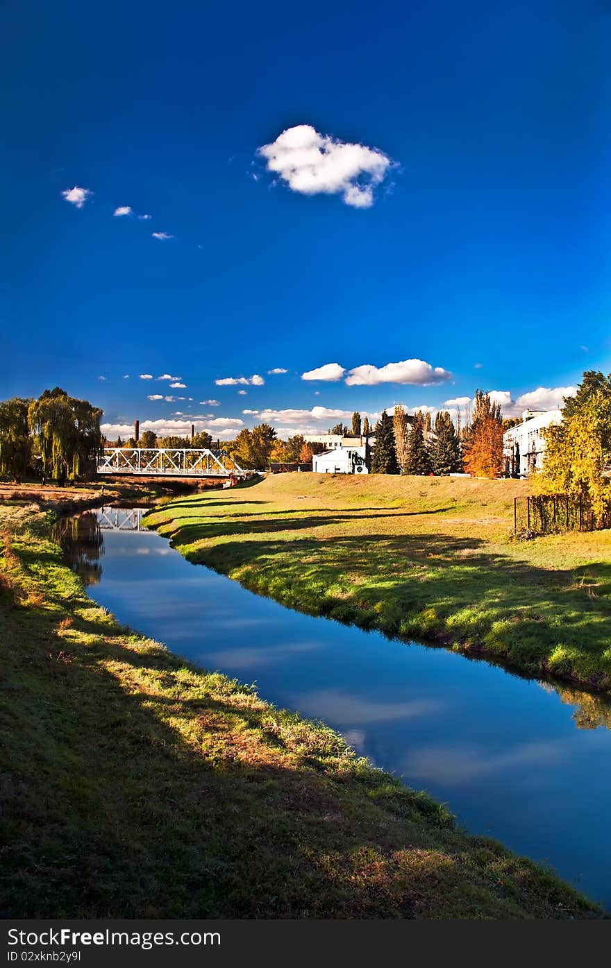 The river flows near to old factory. The river flows near to old factory