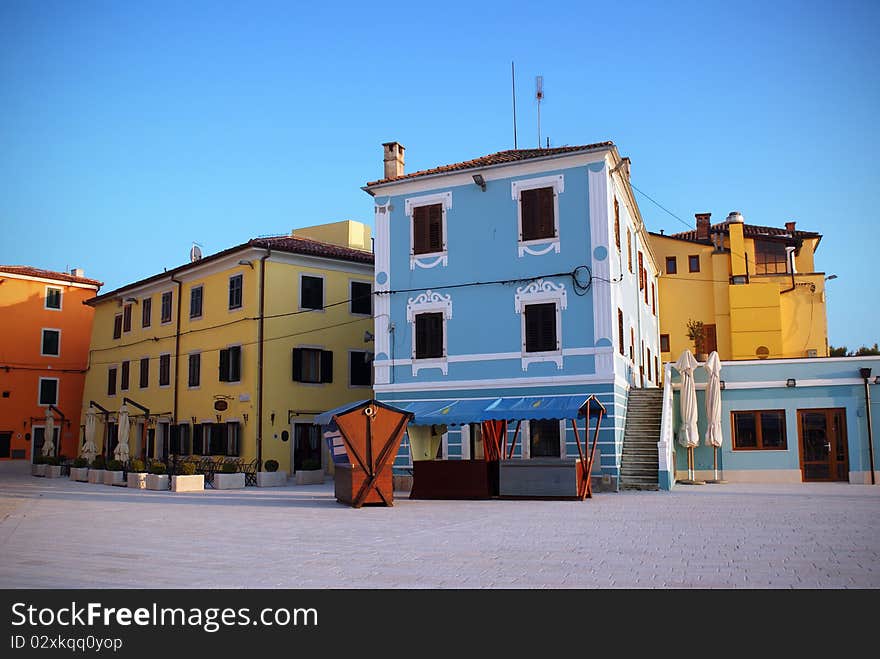 Colourful houses on town square in Fažana, Croatia.