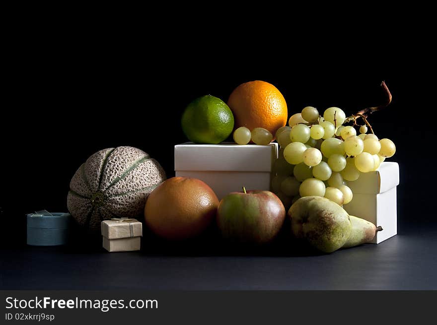 Mixed fruit still life art on a black background. Mixed fruit still life art on a black background