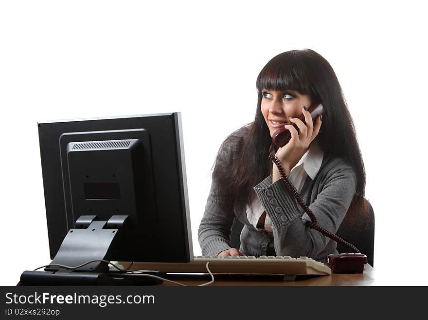 Businesswoman on her workplace hold a phone and smile. Businesswoman on her workplace hold a phone and smile