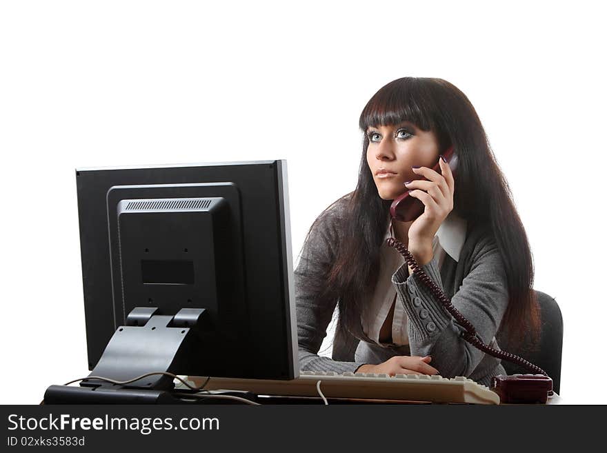 Businesswoman on her workplace with a phone. Businesswoman on her workplace with a phone