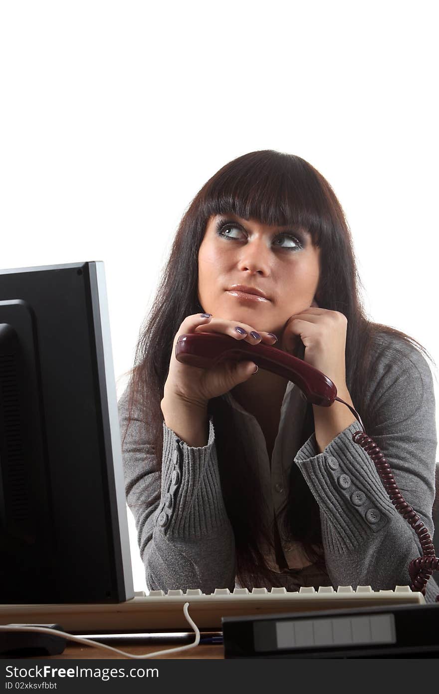 Businesswoman on her workplace with a phone. Businesswoman on her workplace with a phone