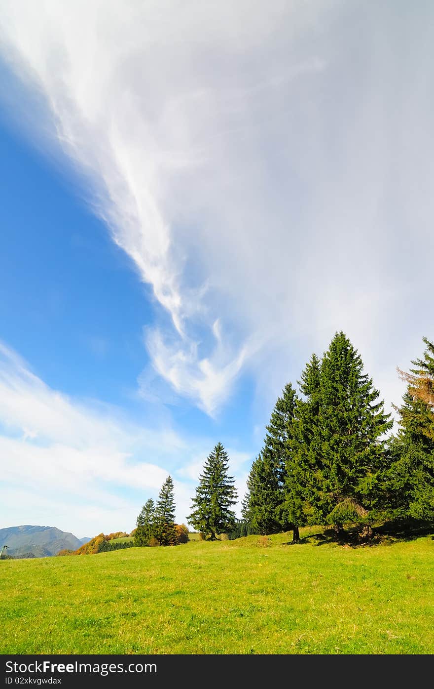 Clouds in the shape of an arrow in the mountains of the Hochbaerneck in Lower Austria on a sunny autumn day. Clouds in the shape of an arrow in the mountains of the Hochbaerneck in Lower Austria on a sunny autumn day