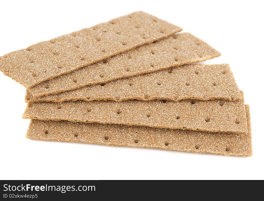 Slices of crispbread isolated on white background. It's good alternative for traditional bread.