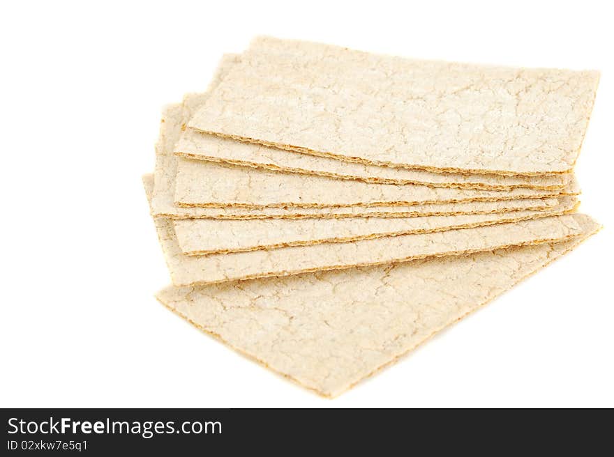 Slices of crispbread isolated on white background. It's good alternative for traditional bread. Original color.