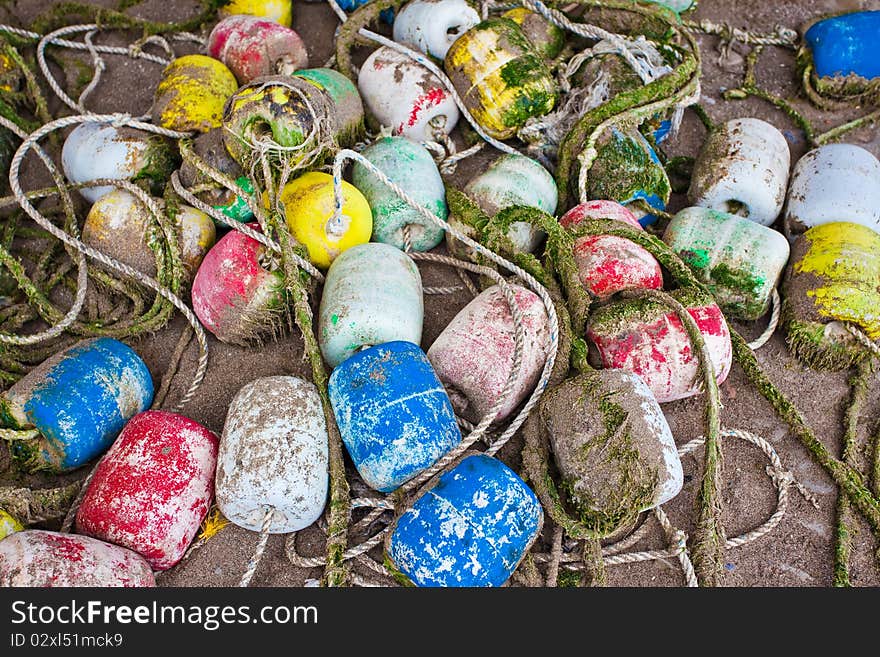 Background made of colorful buoys on sand