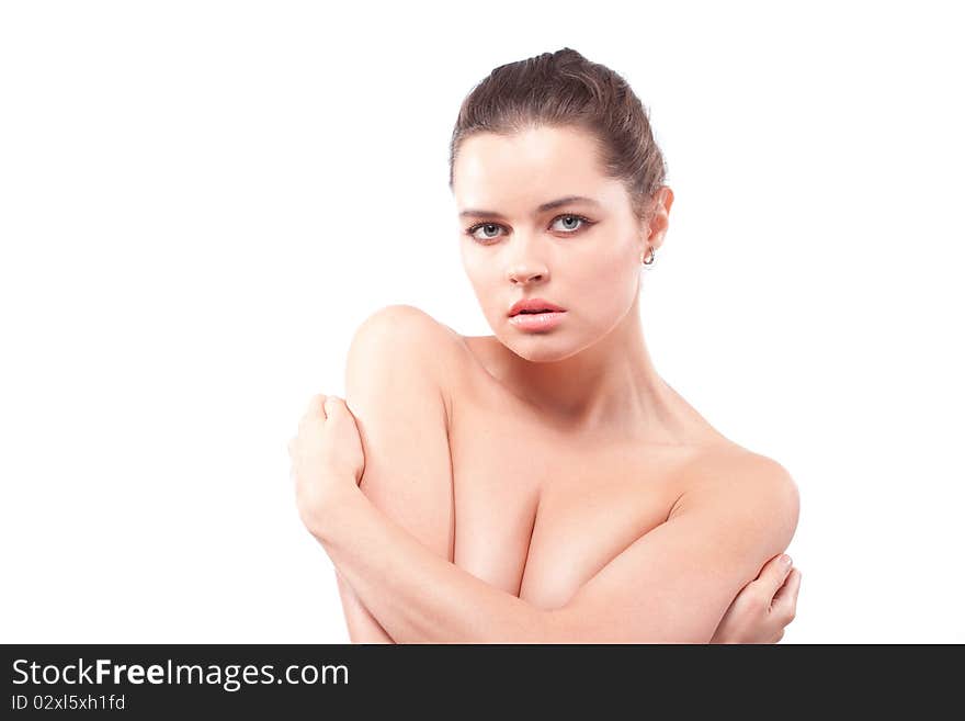 Lonely beautiful brunette woman embracing herself