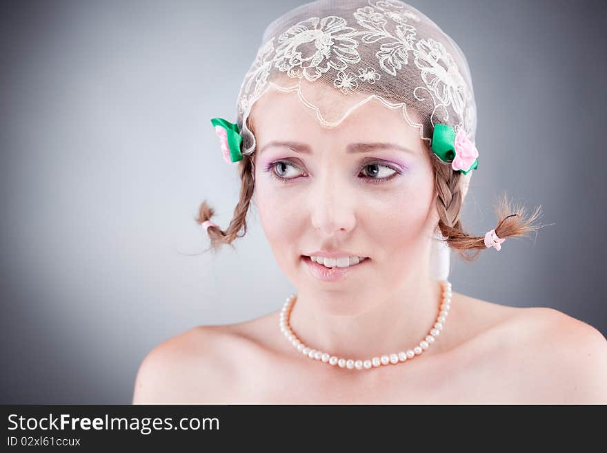 Decicing cute young bride biting her lips