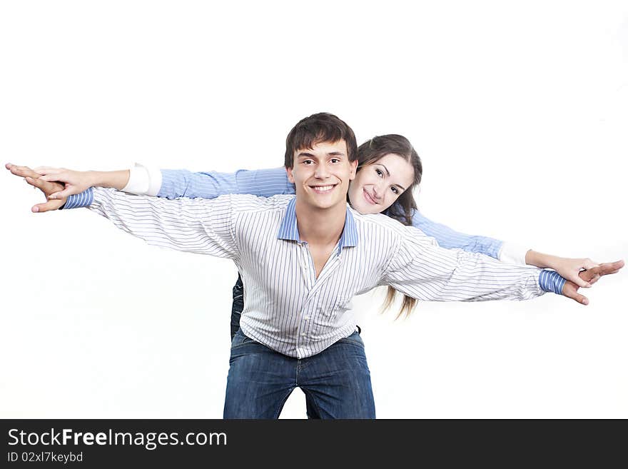 Two young happy person with the hands lifted upwards. Two young happy person with the hands lifted upwards