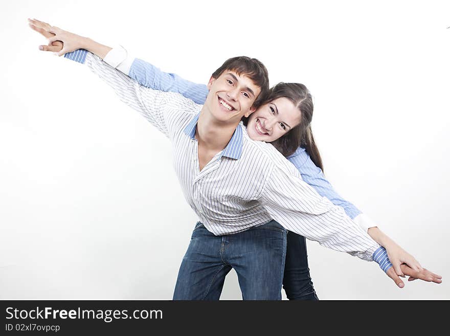 Two young happy person with the hands lifted upwards. Two young happy person with the hands lifted upwards