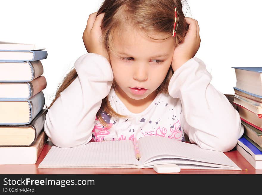 Girl buried in school books. Girl buried in school books